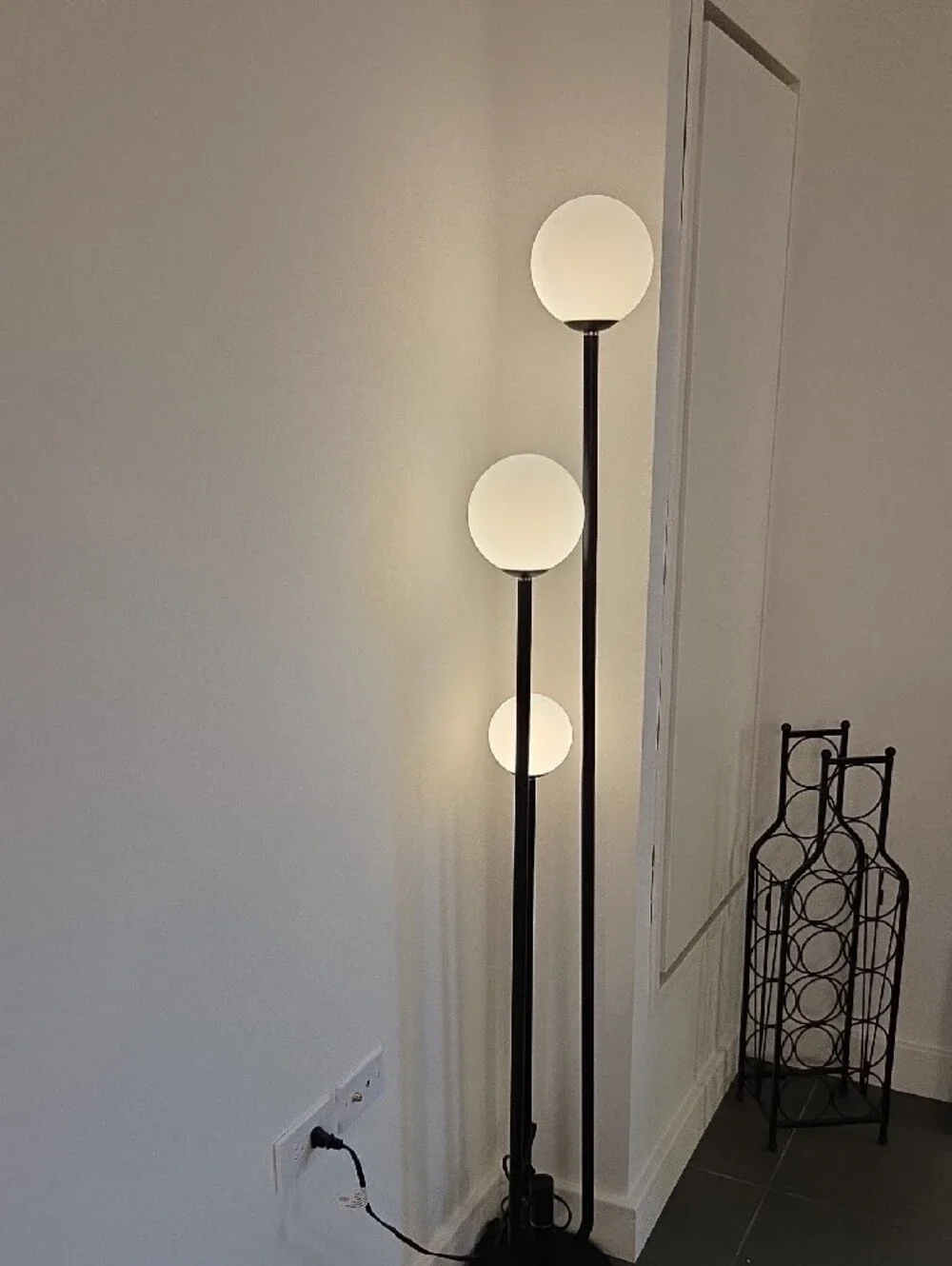 Black Triple-Globe Floor Lamp with White Glass Shades